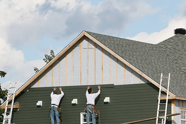 Professional Storm Damage Siding Repair technician working in Dravosburg, PA